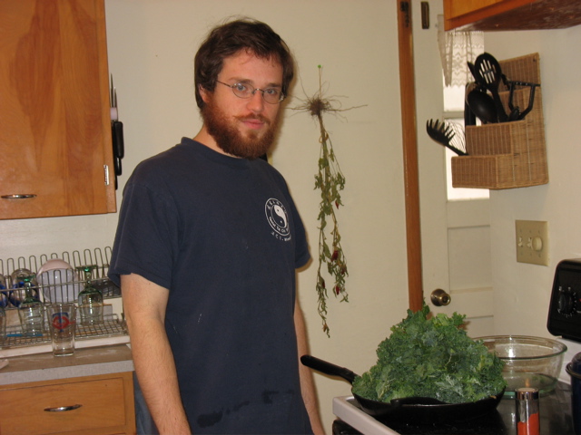 Chris and his giant beard cooking greens